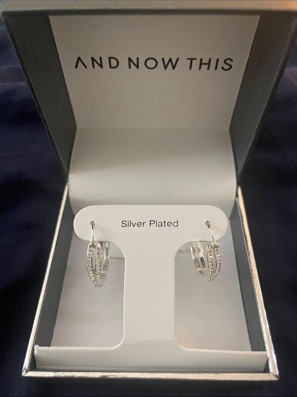 And Now This Crystal Crossover Hoop Earrings. 0.95" diameter. Silver plated. NWT